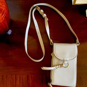 Gray crossbody wallet. Never used. Tassel closure.